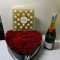Heart-shaped rose box Nairobi,chocolate and champagne gift delivery Kenya,luxury romantic flower combo.