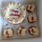 Order a beautifully decorated red and white birthday cake with matching cupcakes for same-day delivery in Nairobi.