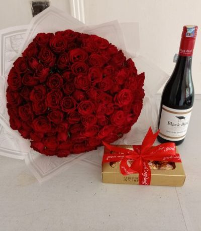 red rose and wine gift Nairobi,romantic flower delivery Kenya,Valentine’s bouquet combo,Ferrero chocolate and roses,anniversary gifts with wine Nairobi