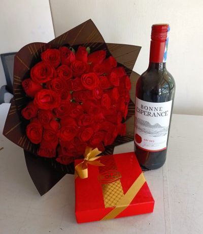 romantic gift combo Nairobi,red roses wine and chocolate,Valentine’s Day flowers Kenya,anniversary gift set with wine,wine and rose bouquet Nairobi